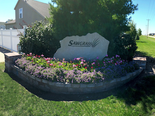 Sawgrass entrance with bluegrass landscaping